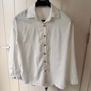 Timeless White Button-Down Blouse with Tortoise Detail
